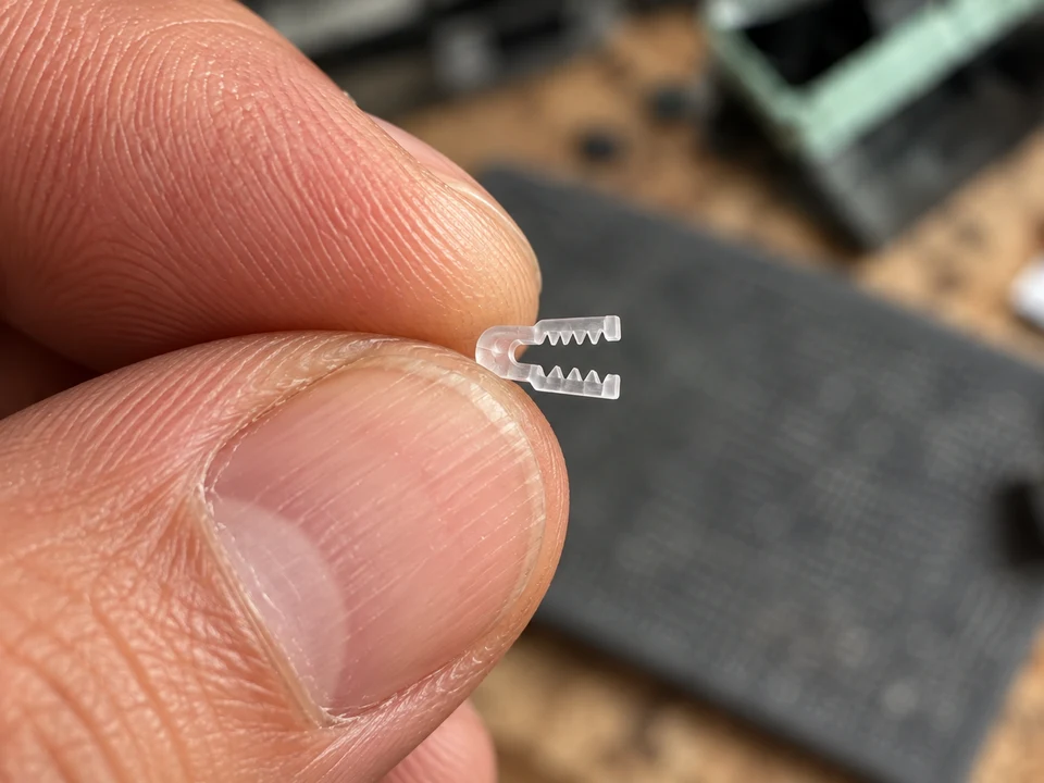 The same micro-jaw held between fingertips.